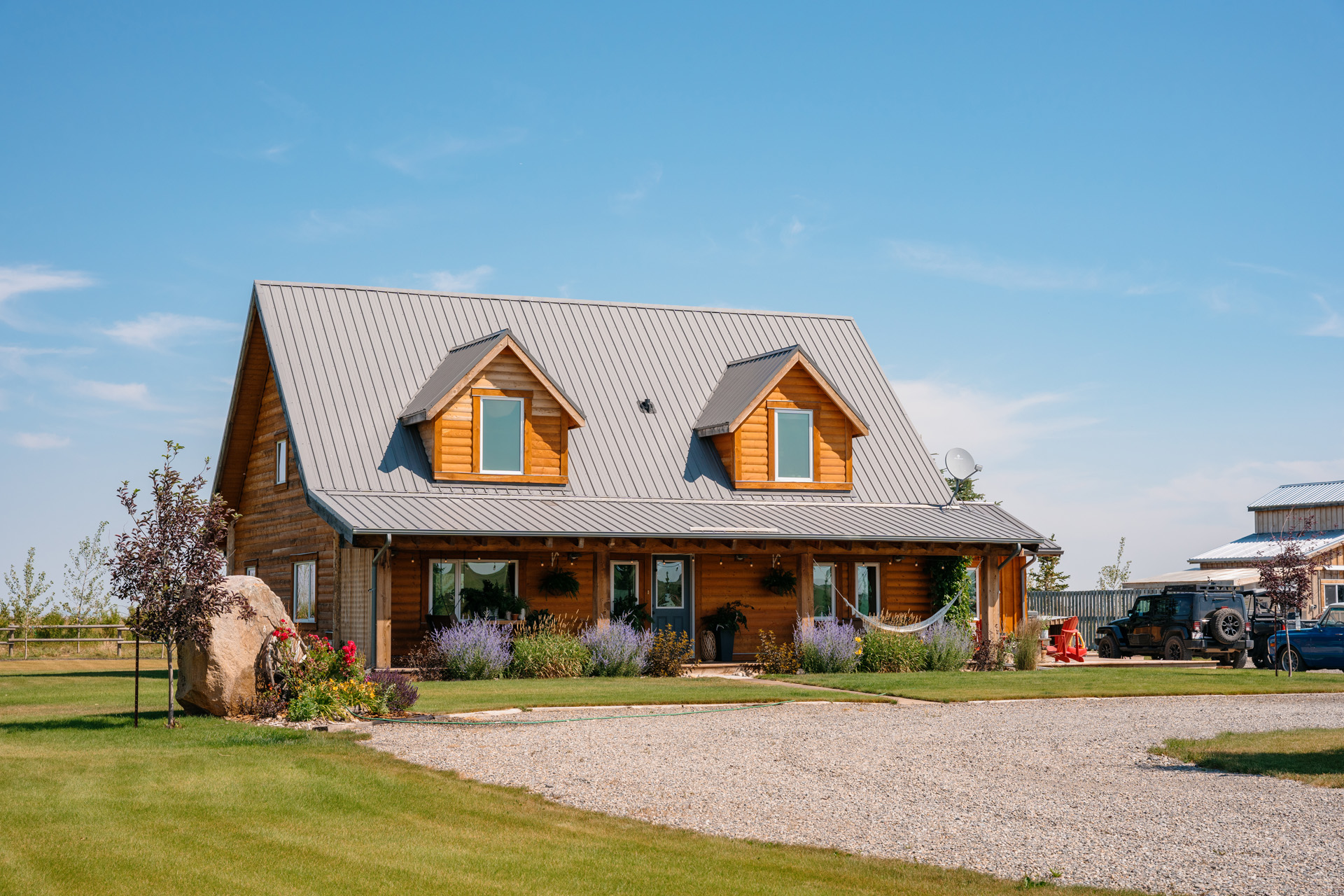 An ICF house in a rural area of Alberta, Canada has sloped roofing and dormer windows.