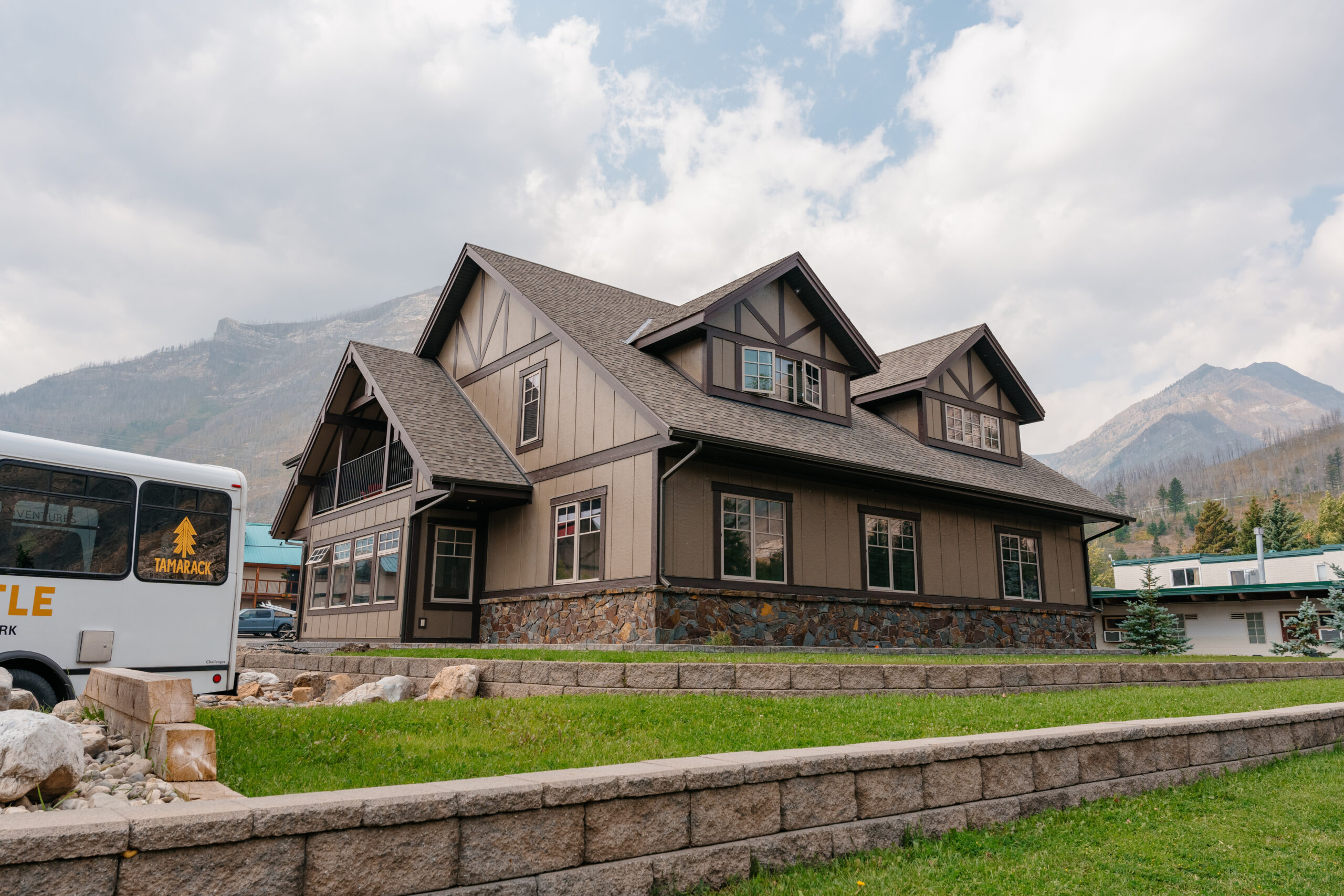 This image shows a brown building made from ICF construction in a mountainous area. 