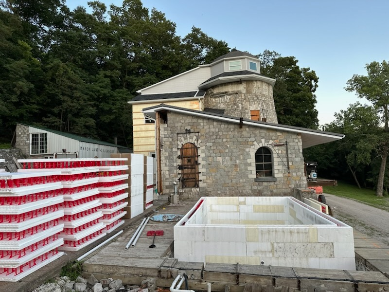 An ICF pool is being constructed. SuperForm ICF blocks are stacked on the job site.